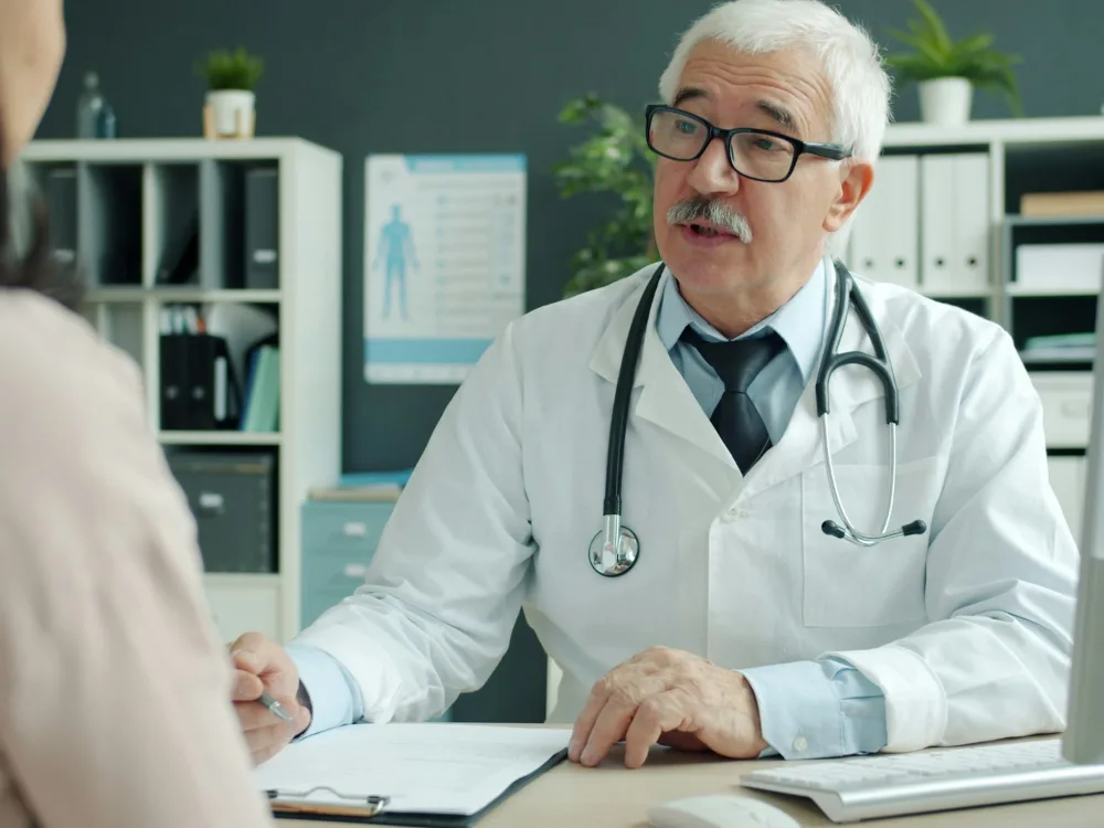 A doctor talking with a patient